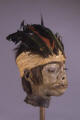 feather headdress shrunken head
